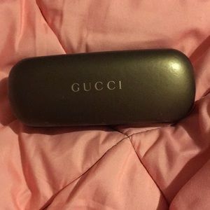 A Gucci eyeglass case.